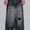 Svarta, slitna XL Colossus Jeans