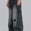 Svarta, slitna XL Colossus Jeans