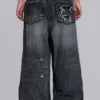 Svarta, slitna XL Colossus Jeans