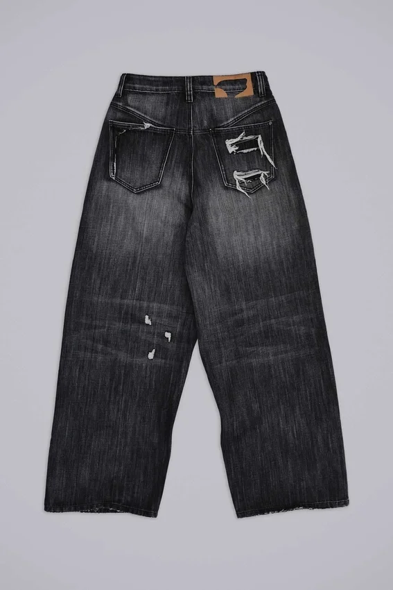 Svarta, slitna XL Colossus Jeans