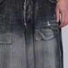 Svarta, slitna XL Colossus Jeans