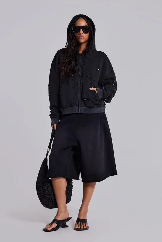 Tvättad svart hoodie med dragkedja, solblekt och våffelfodrad