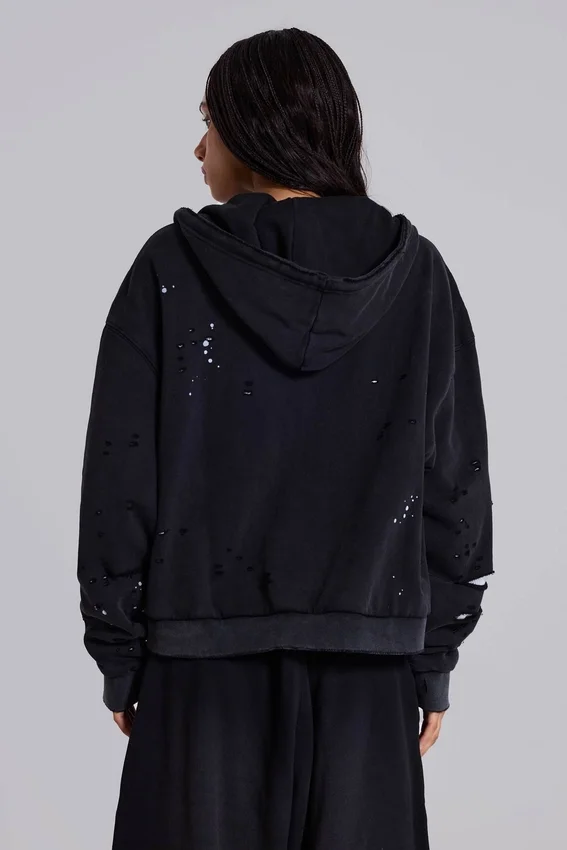 Tvättad svart hoodie med dragkedja, solblekt och våffelfodrad