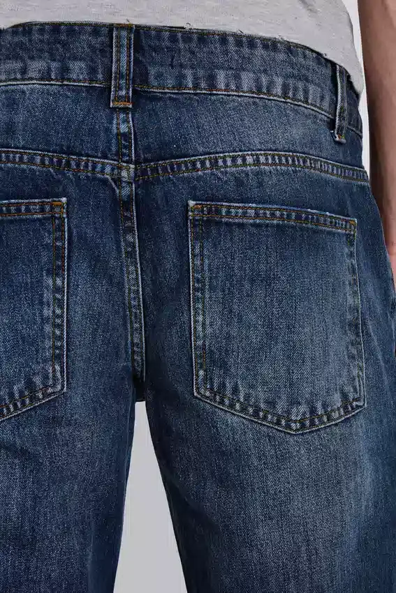 Vintage-tvättade Jude Bootcut-jeans med utsvängda ben