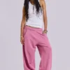 Rosa, vidbyxor med uppvikt benslut i Monster Joggers-stil